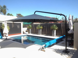 canter lever umbrella over pool